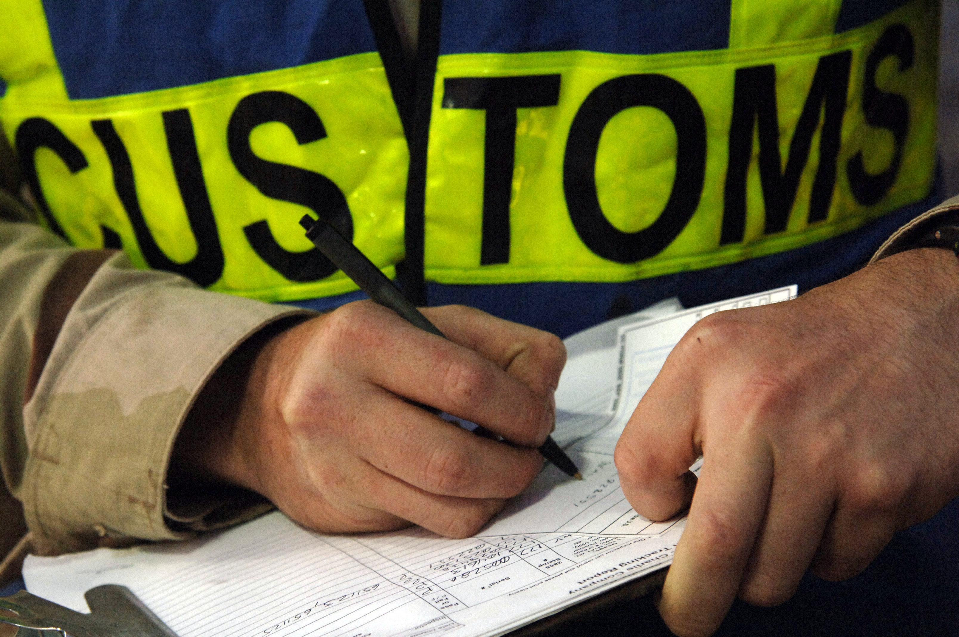 061209-N-8148A-067
Camp Patriot, Kuwait (Dec. 9, 2006) - A customs border clearance agent assigned to Navy Customs Battalion Romeo keeps record of each inspection. Navy Customs Battalion Romeo, comprised of more than 450 reservists, was mobilized, trained, equipped and deployed by the Navy Expeditionary Logistics Support Group and is an operational force under the Navy Expeditionary Combat Command. U.S. Navy photo by Mass Communication Specialist 2nd Class Kitt Amaritnant (RELEASED)